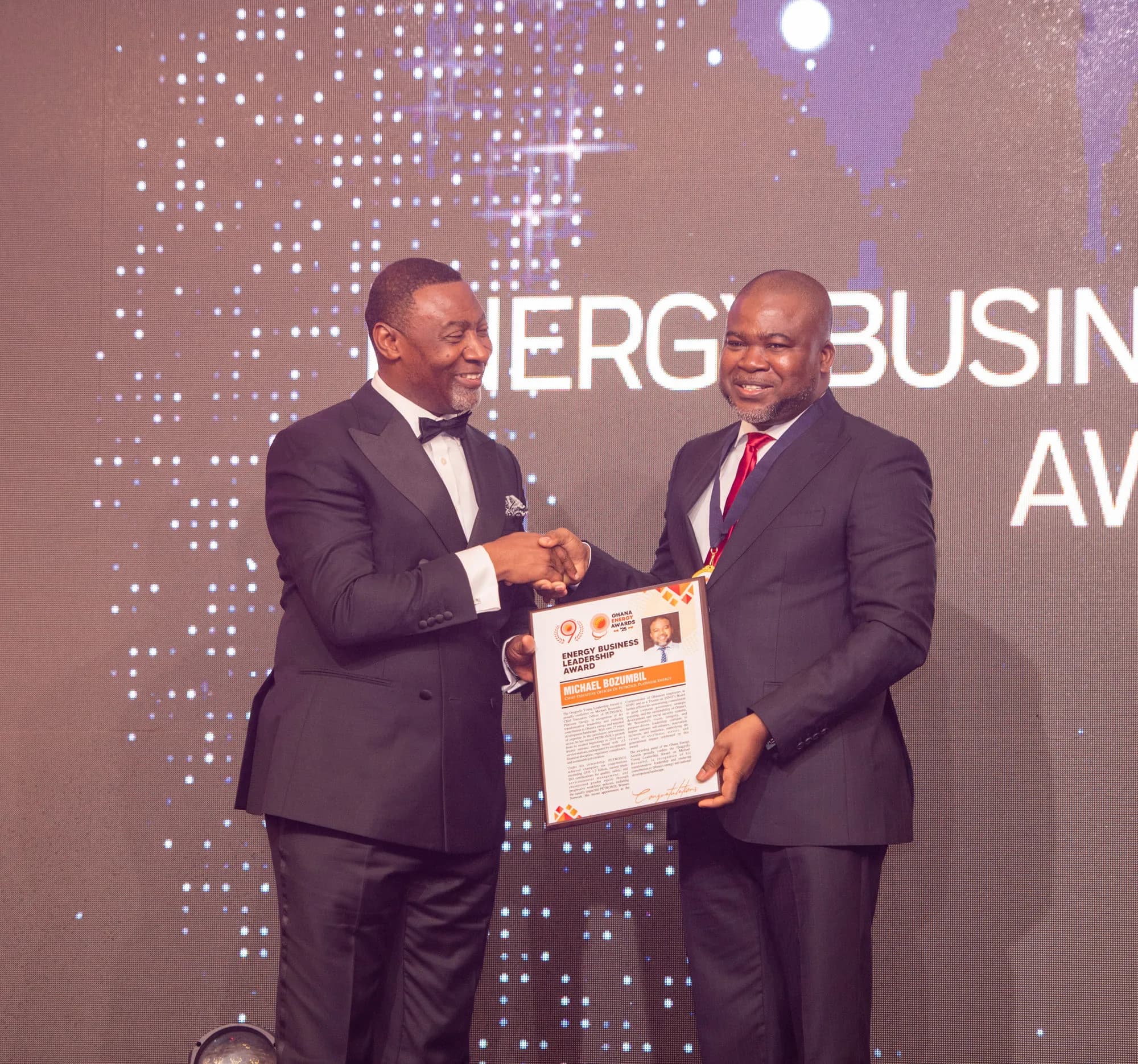 PETROSOL CEO Michael Bozumbil receiving his award citation on stage